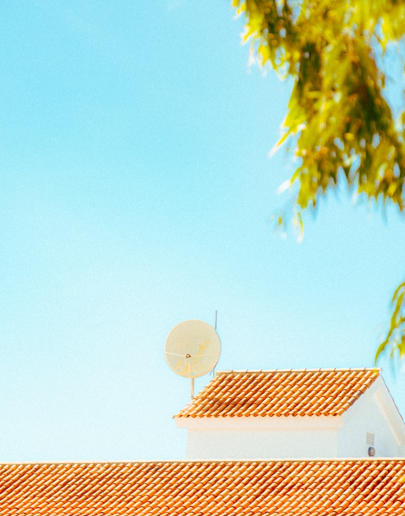 Satellite dish installation on a building